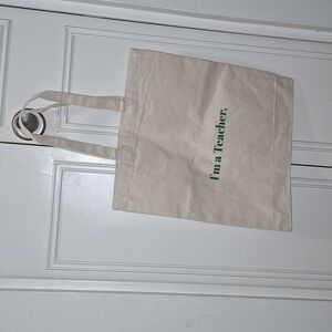 NWOT- cotton canvas tote bag with green lettering (I'm a Teacher,)